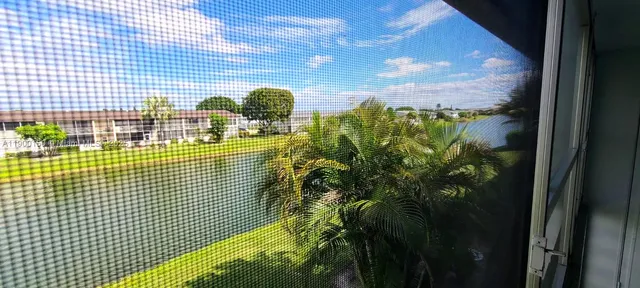 a bathroom with a sink mirror vanity and toilet