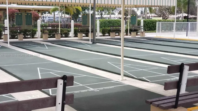 a view of a swimming pool with a garden and plants