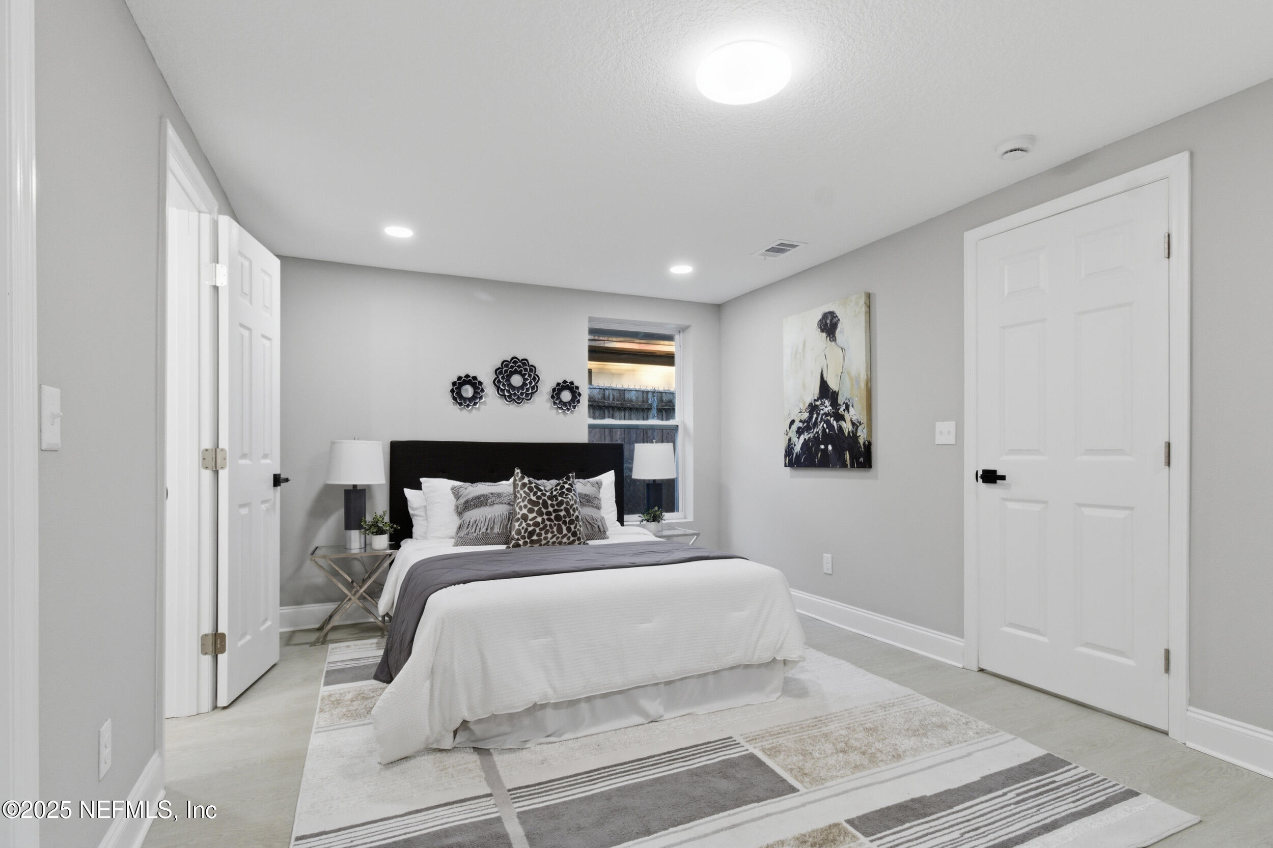 5475 Gable Lane Jacksonville, FL 32211 - Photo 14 of 36 a bed room with a bed and a painting