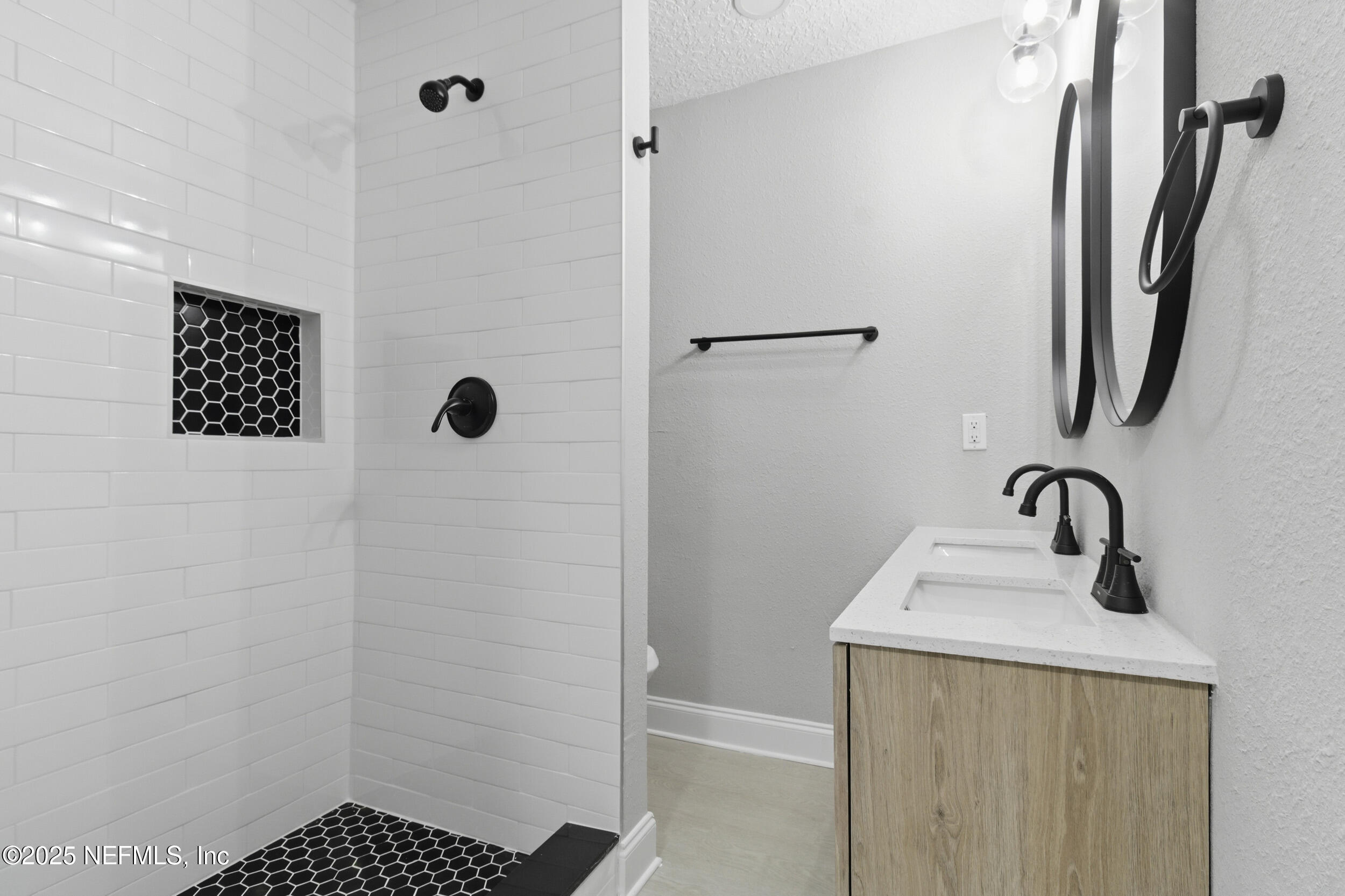 5475 Gable Lane Jacksonville, FL 32211 - Photo 24 of 36 a bathroom with a sink a toilet and shower
