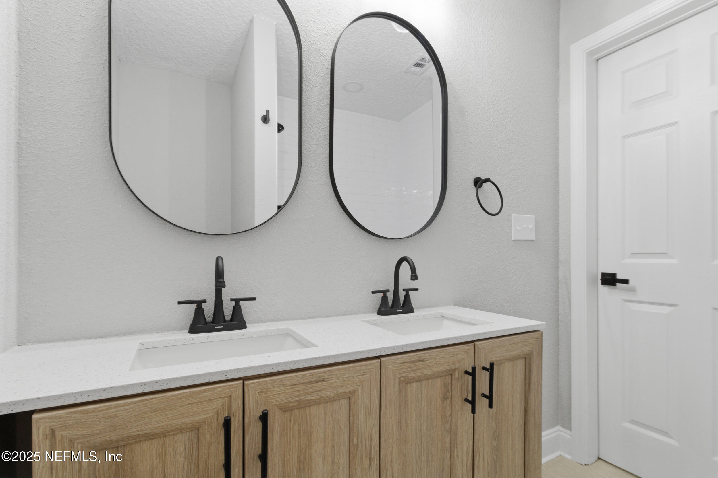 5475 Gable Lane Jacksonville, FL 32211 - Photo 25 of 36 a bathroom with a sink and a mirror