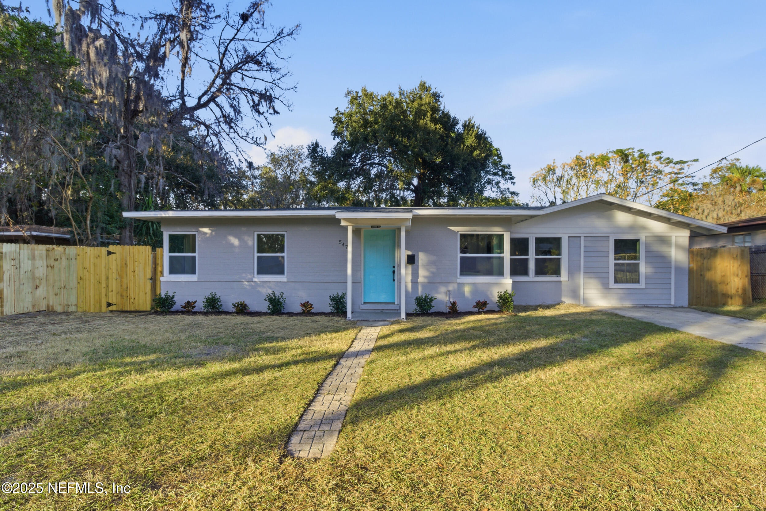 5475 Gable Lane Jacksonville, FL 32211 - Photo 3 of 36 a view of a house with a patio and yard