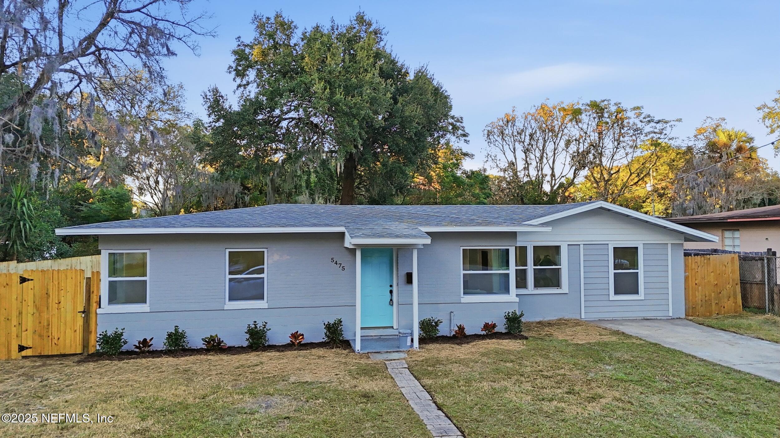 5475 Gable Lane Jacksonville, FL 32211 - Photo 33 of 36 a front view of a house with a yard