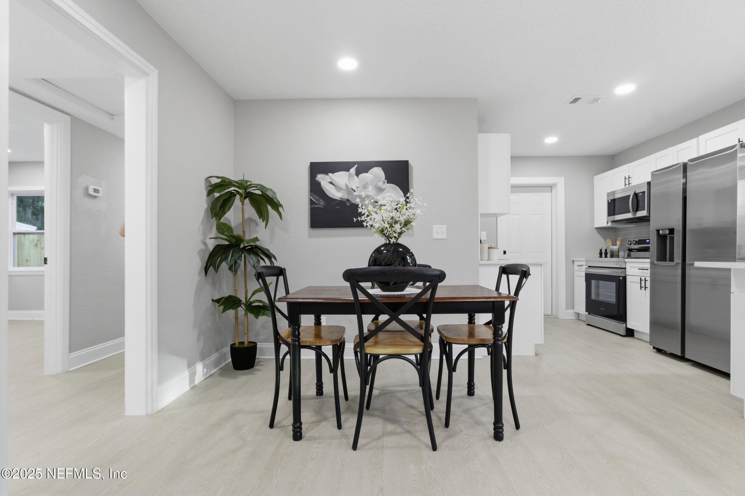 5475 Gable Lane Jacksonville, FL 32211 - Photo 5 of 36 a view of a dining room with furniture