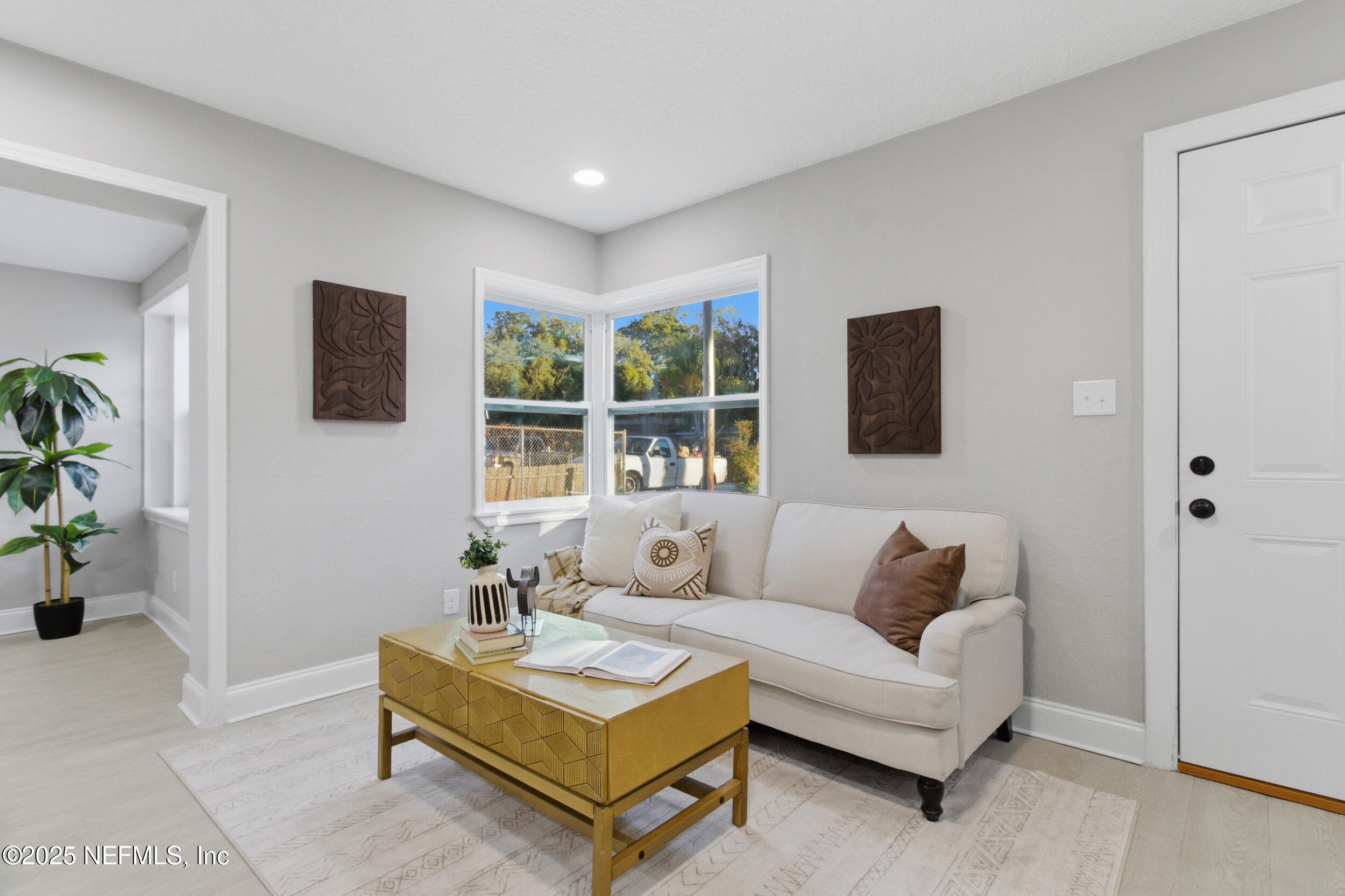 5475 Gable Lane Jacksonville, FL 32211 - Photo 10 of 36 a living room with furniture a flat screen tv and a window