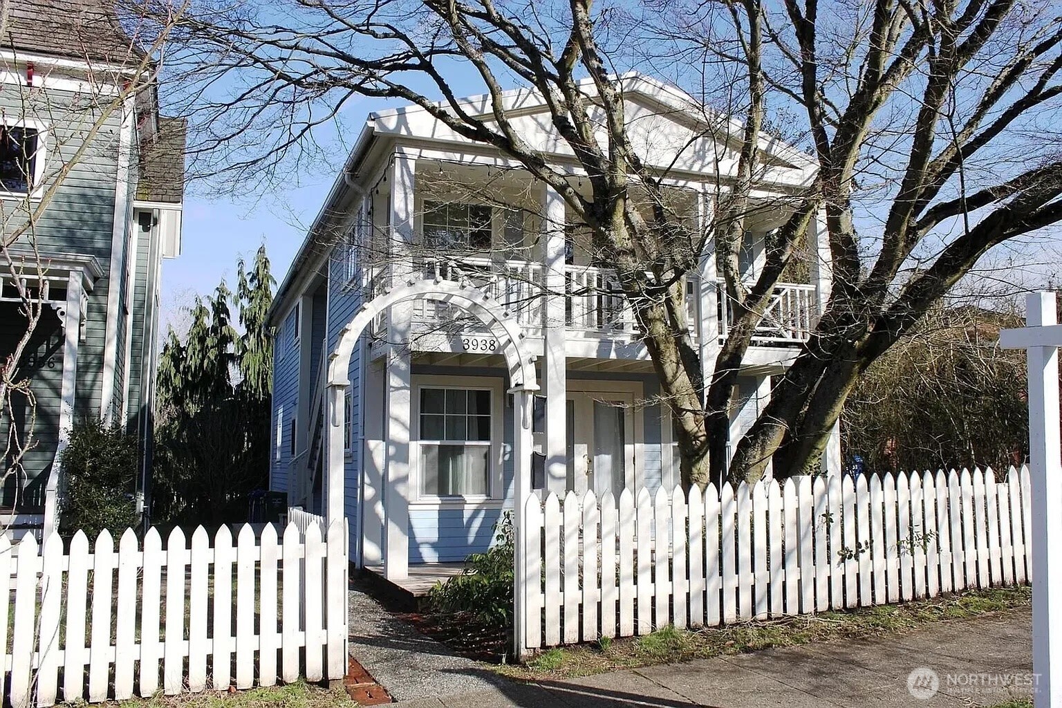 3938 South Ferdinand Street, Unit A Seattle, WA 98118 - Photo 1 of 1 a front view of a house with a tree