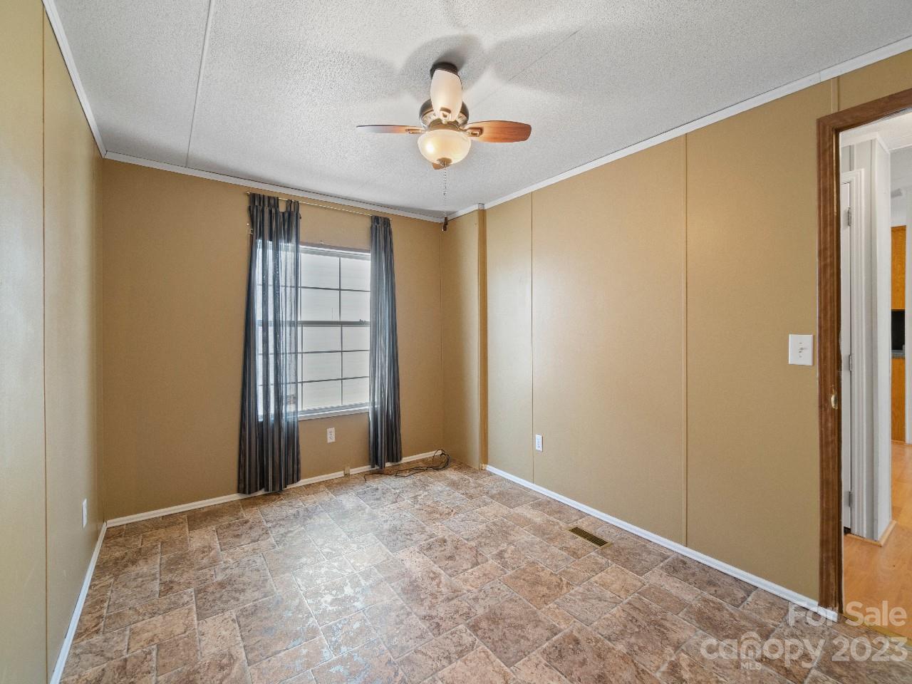 6580 Houser Farm Road Vale, NC 28168 - Photo 24 of 36 a view of a livingroom with a chandelier fan and windows