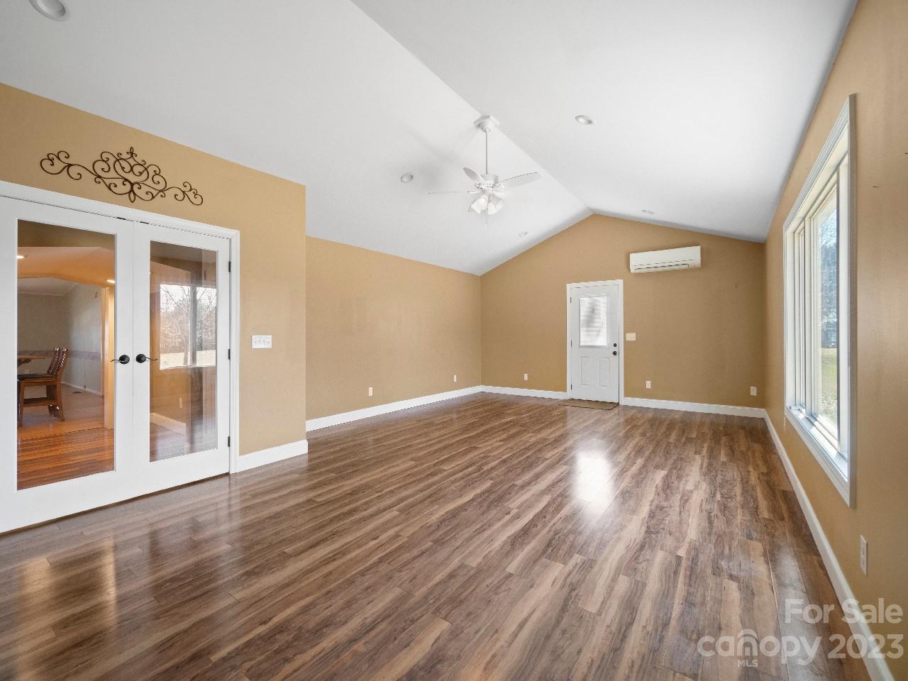 6580 Houser Farm Road Vale, NC 28168 - Photo 27 of 36 a view of an empty room with wooden floor and a window