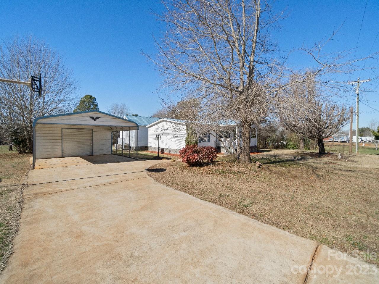 6580 Houser Farm Road Vale, NC 28168 - Photo 3 of 36 a front view of a house with a yard