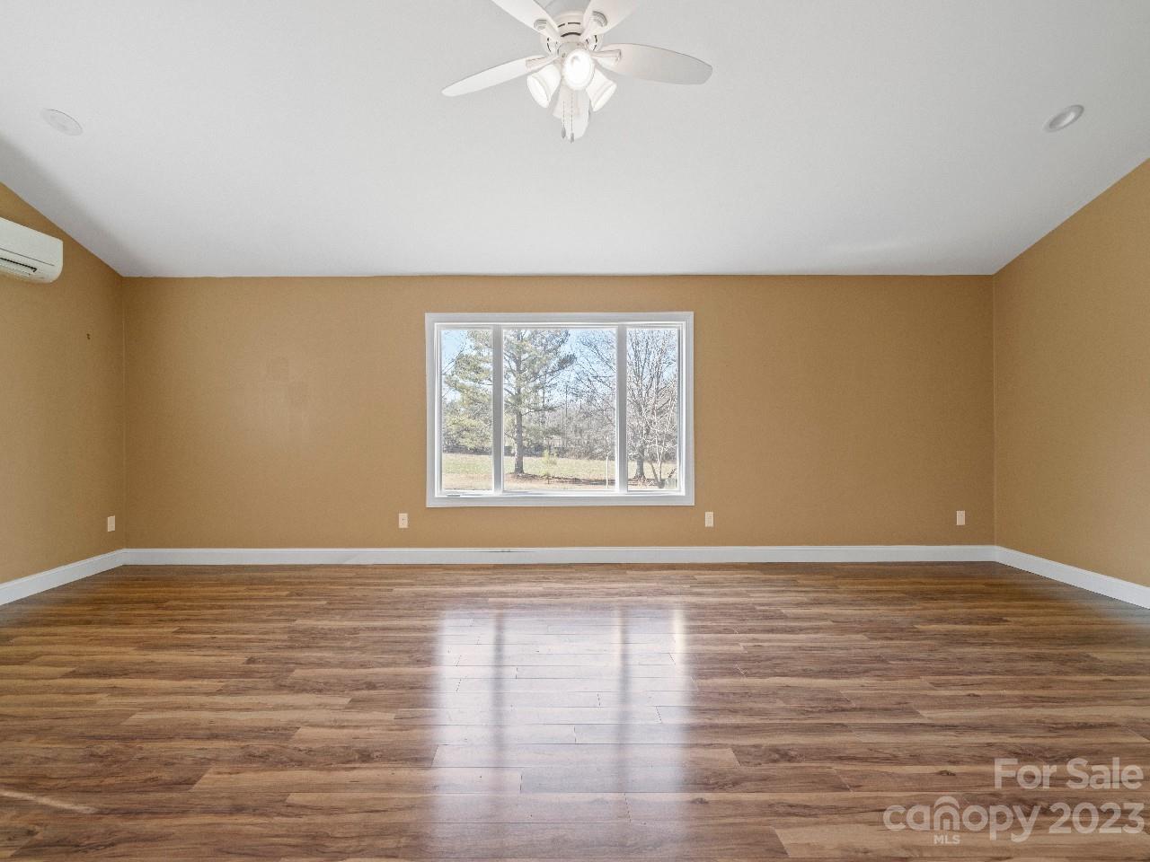 6580 Houser Farm Road Vale, NC 28168 - Photo 31 of 36 a view of an empty room with wooden floor and a window