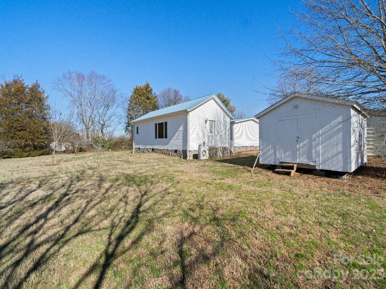 6580 Houser Farm Road Vale, NC 28168 - Photo 34 of 36 a view of a house with a yard