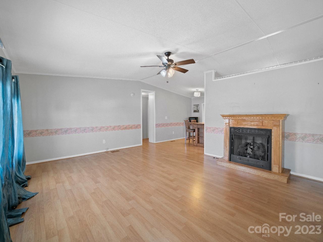 6580 Houser Farm Road Vale, NC 28168 - Photo 5 of 36 an empty room with windows and fireplace