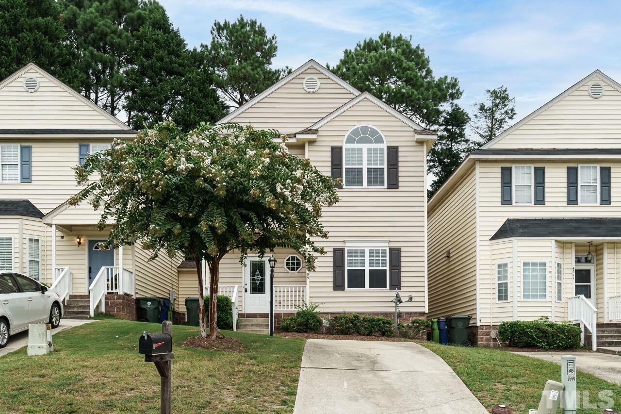 4509 Pinckney Place Raleigh, NC 27604 - Photo 1 of 28 a front view of a house with a yard