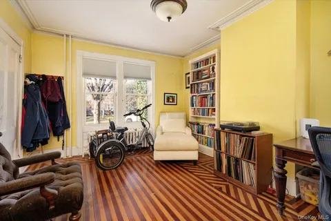 a view of a livingroom with furniture and gym equipment