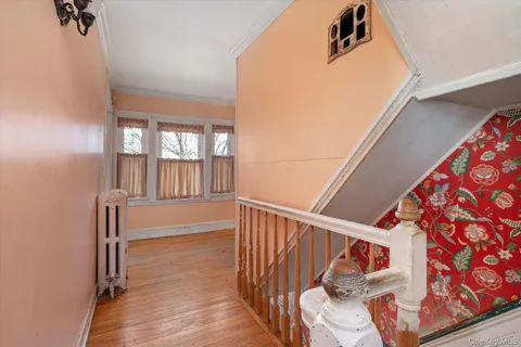 a view of entryway with wooden floor