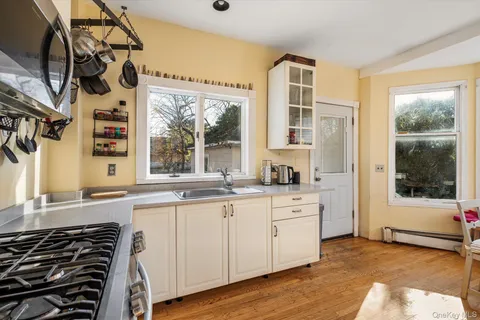 a kitchen with a sink stove and cabinets