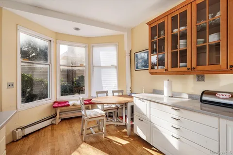 a very nice looking room with a large window and a table