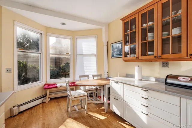 a very nice looking room with a large window and a table