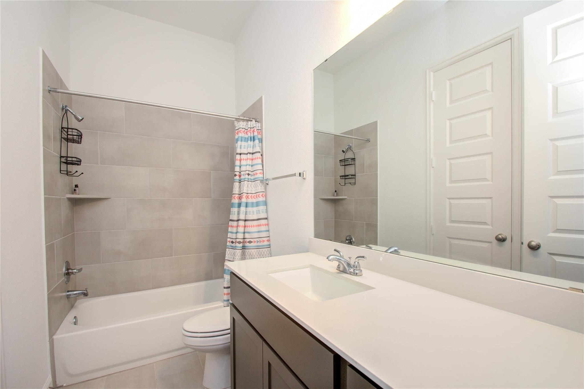 3011 Harbor Spring Way Manvel, TX 77578 - Photo 24 of 29 a bathroom with a sink a toilet and shower