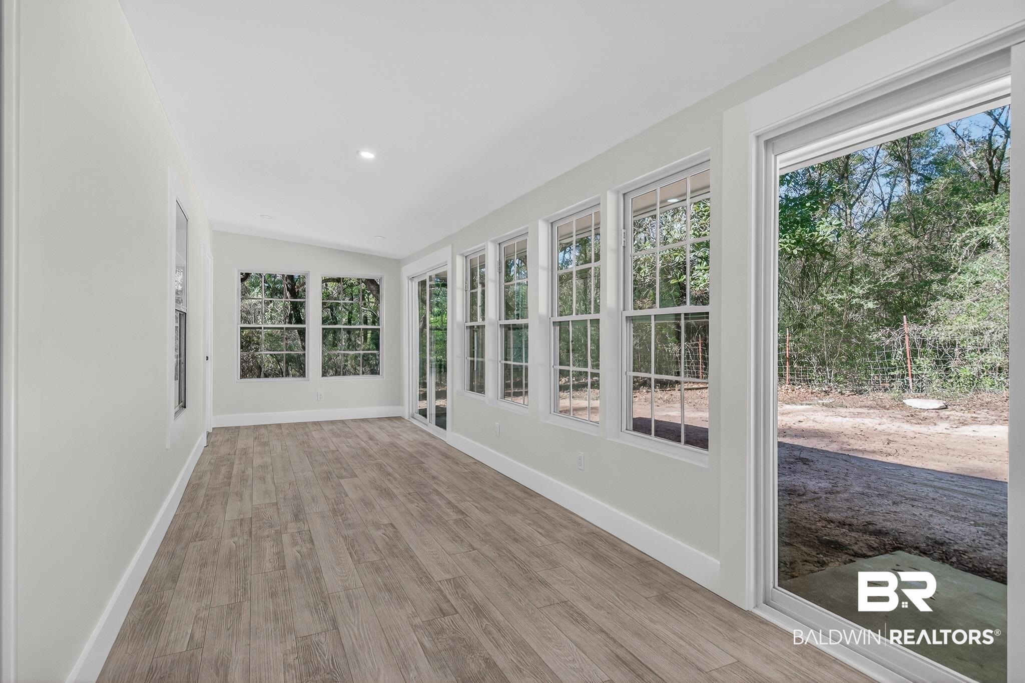 10650 Old Pascagoula Road Theodore, AL 36582 - Photo 72 of 77 Unfurnished sunroom with wood finished floors and recessed lighting