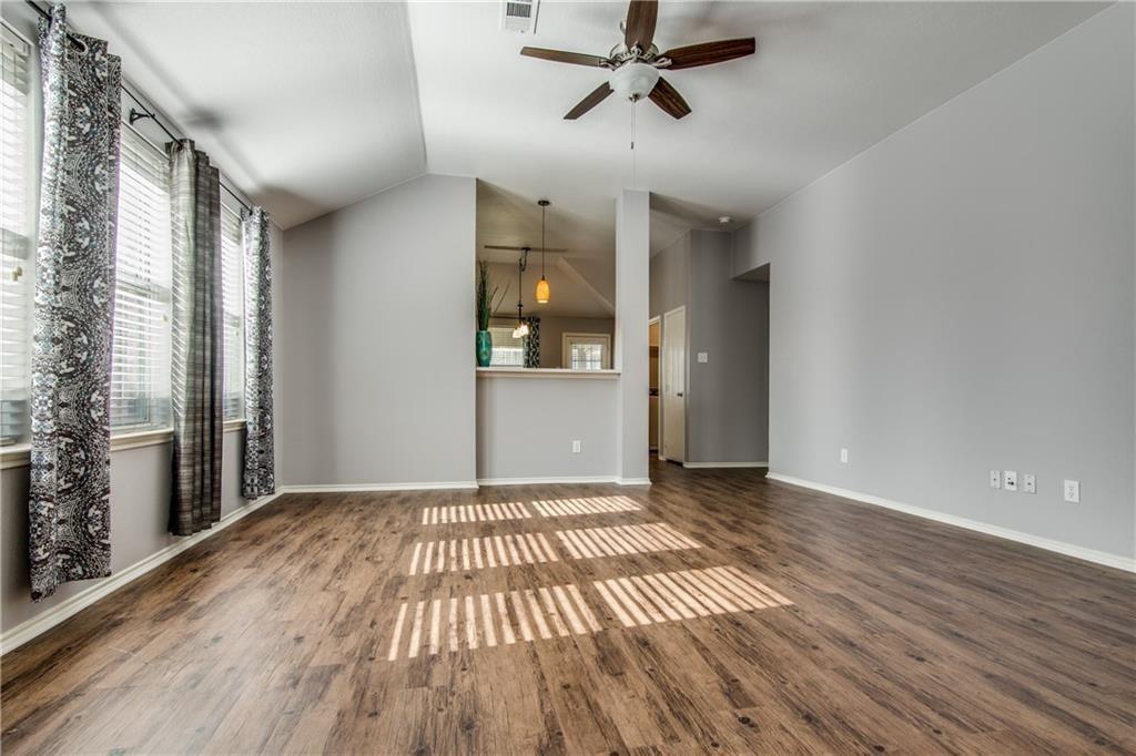 3608 Diamond Ranch Road Fort Worth, TX 76262 - Photo 3 of 13 Spare room with ceiling fan, dark wood-type flooring, and lofted ceiling
