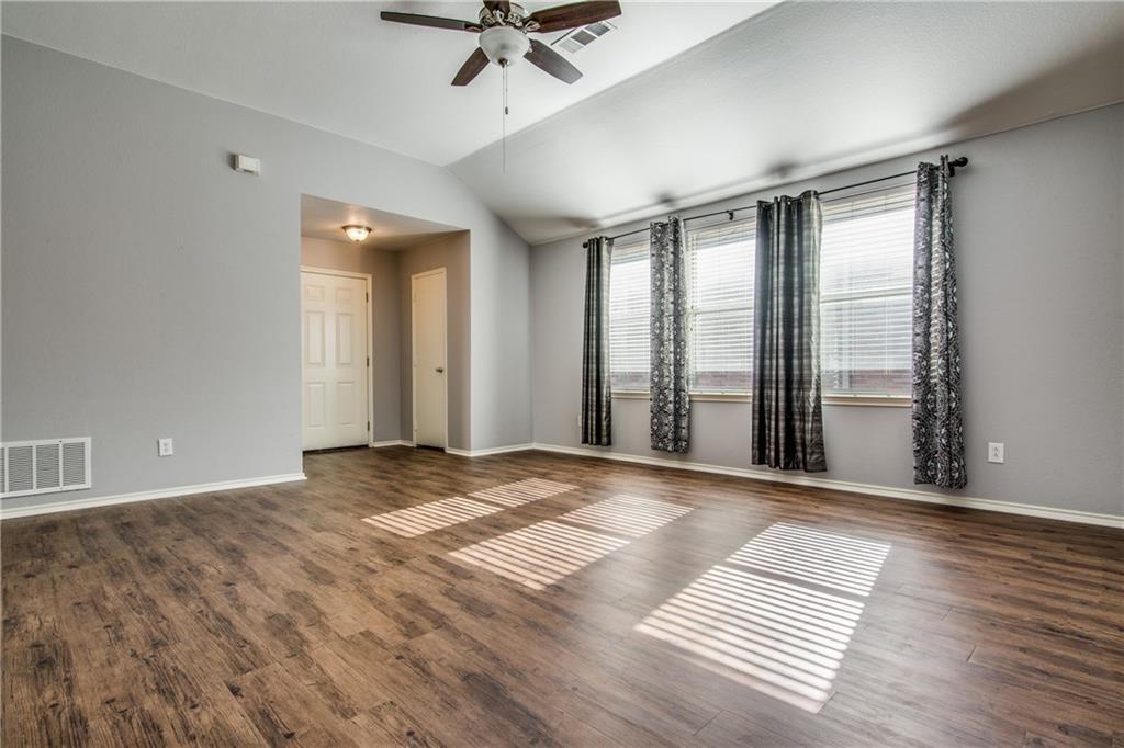 3608 Diamond Ranch Road Fort Worth, TX 76262 - Photo 4 of 13 Spare room featuring a ceiling fan, vaulted ceiling, and dark wood-type flooring