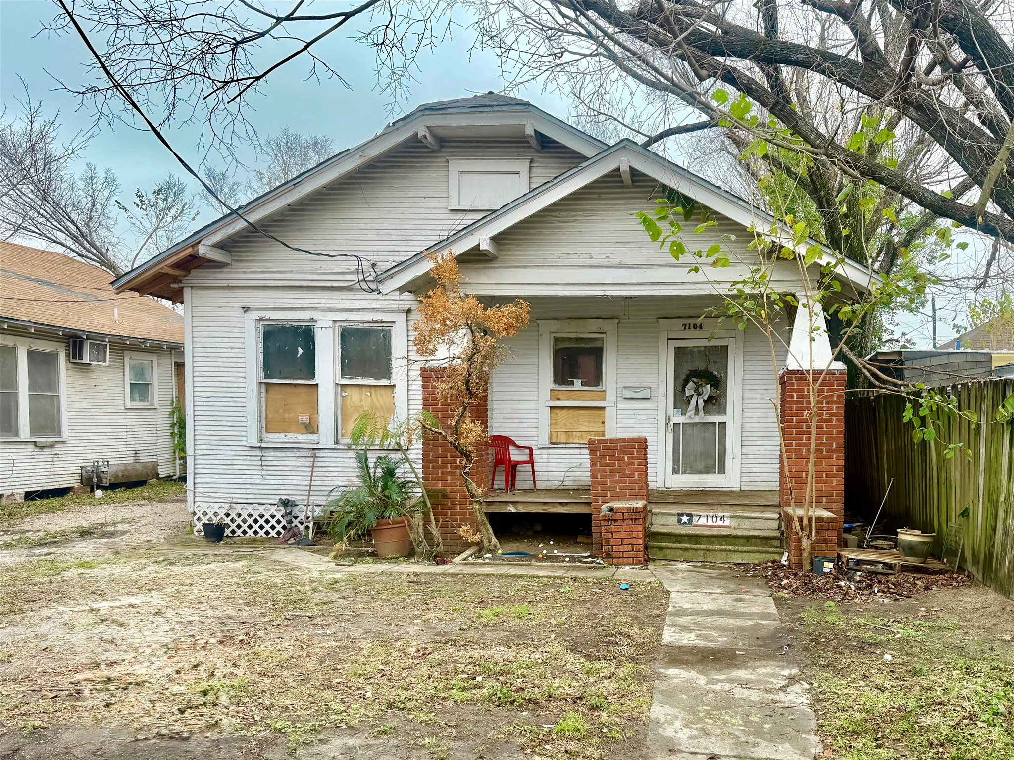 7106 Sherman Street Houston, TX 77011 - Photo 3 of 6 a front view of a house with a porch