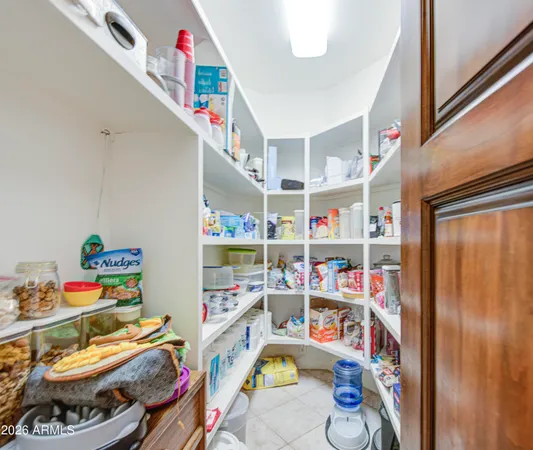 a spacious bathroom with a double vanity sink a mirror and shower