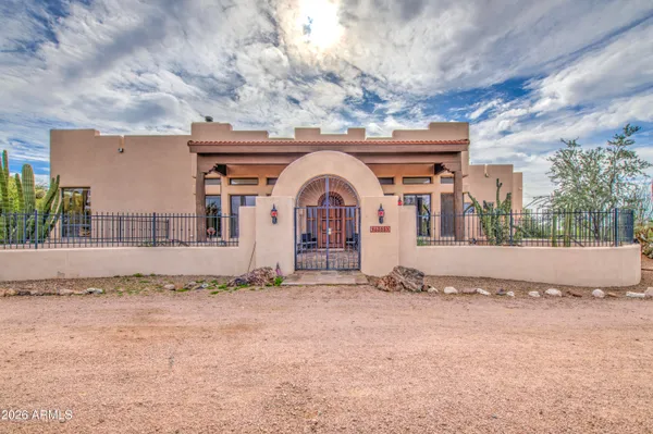 a view of a brick house with large windows