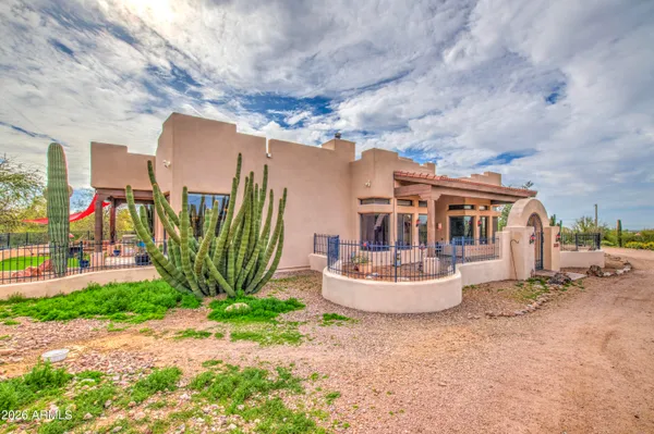 a large kitchen with stainless steel appliances granite countertop a lot of cabinets a stove and a refrigerator