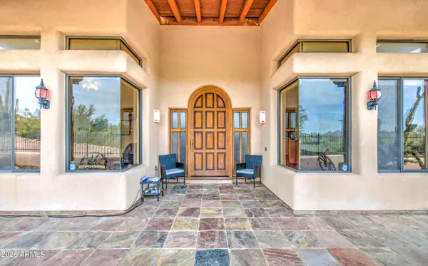 a large kitchen with a table chairs refrigerator and cabinets
