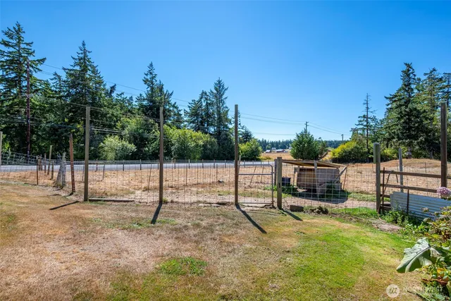 a view of a backyard with swings