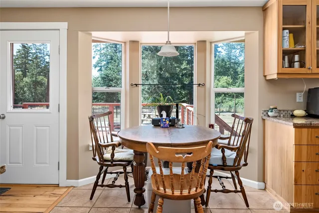 a dining room with furniture and window
