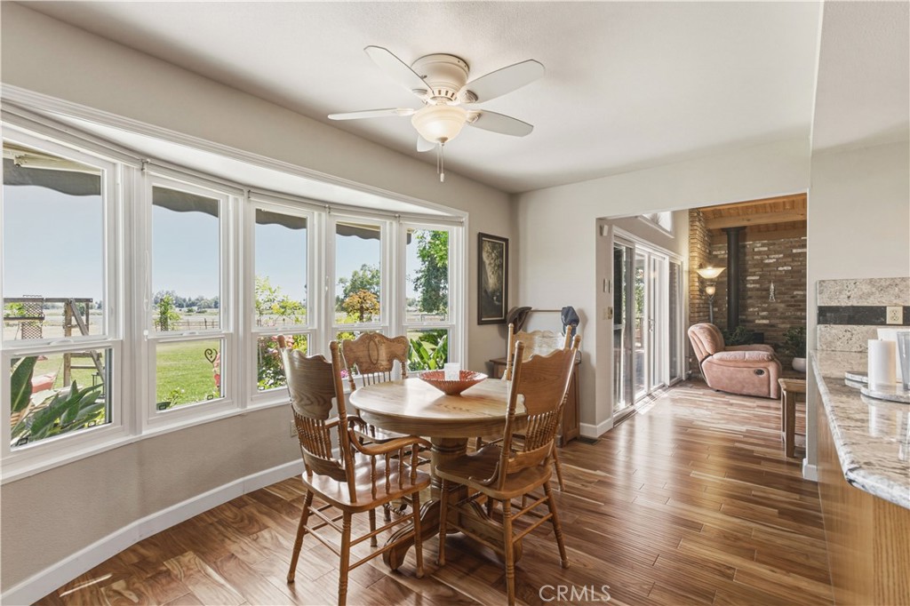 3856 North Gardner Avenue Merced, CA 95340 - Photo 8 of 59 a dining room with furniture window and wooden floor