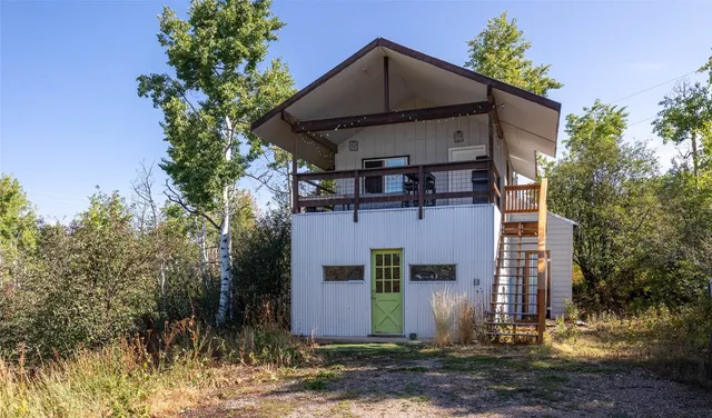 a view of a chairs and table in patio