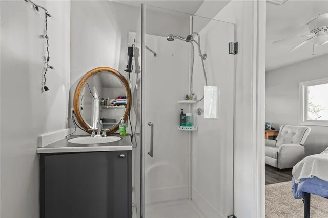 a kitchen with refrigerator and cabinets