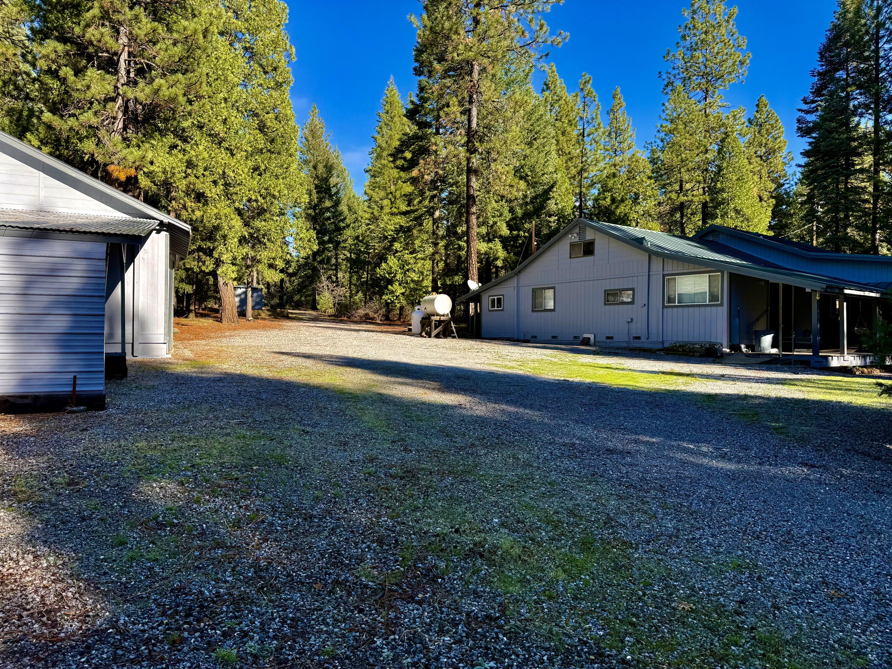 33250 Plateau Pines Road Shingletown, CA 96088 - Photo 1 of 52 driveway in from gate