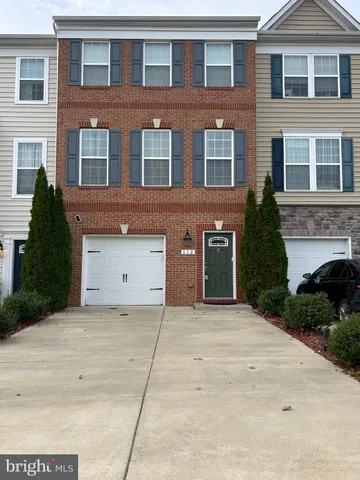 a front view of a house with yard