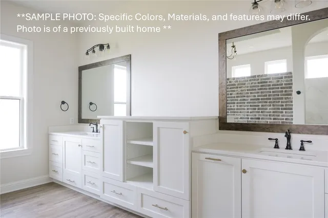 a bathroom with a sink vanity and a mirror