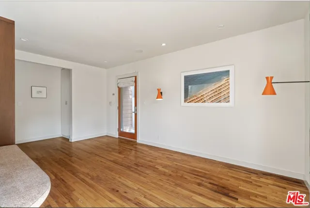 a living room with a couch and dresser