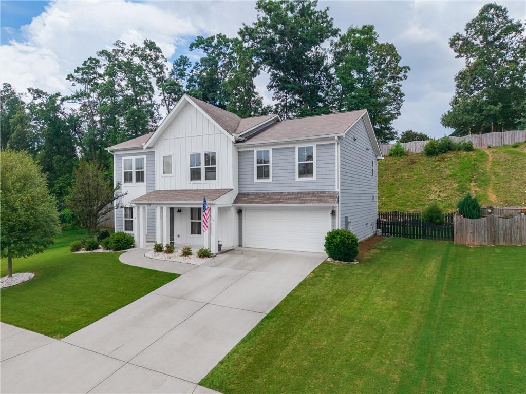 230 Augusta Walk Canton, GA 30114 - Photo 53 of 56 a view of house with a yard and potted plants