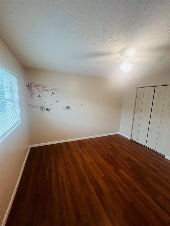 715 Michigan Court, Unit 3 St. Cloud, FL 34769 - Photo 11 of 15 a view of empty room with wooden floor
