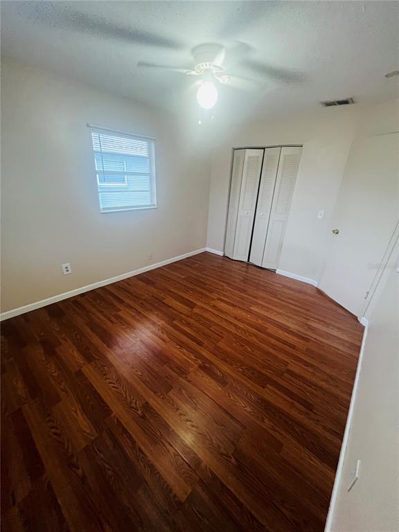715 Michigan Court, Unit 3 St. Cloud, FL 34769 - Photo 15 of 15 a view of empty room with wooden floor