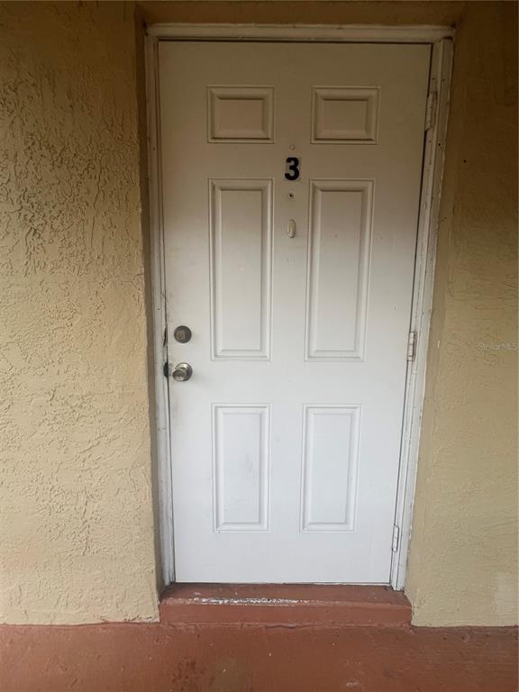 715 Michigan Court, Unit 3 St. Cloud, FL 34769 - Photo 4 of 15 a view of front door