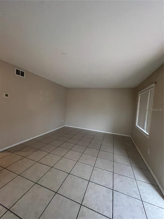 715 Michigan Court, Unit 3 St. Cloud, FL 34769 - Photo 10 of 15 a view of an empty room and window