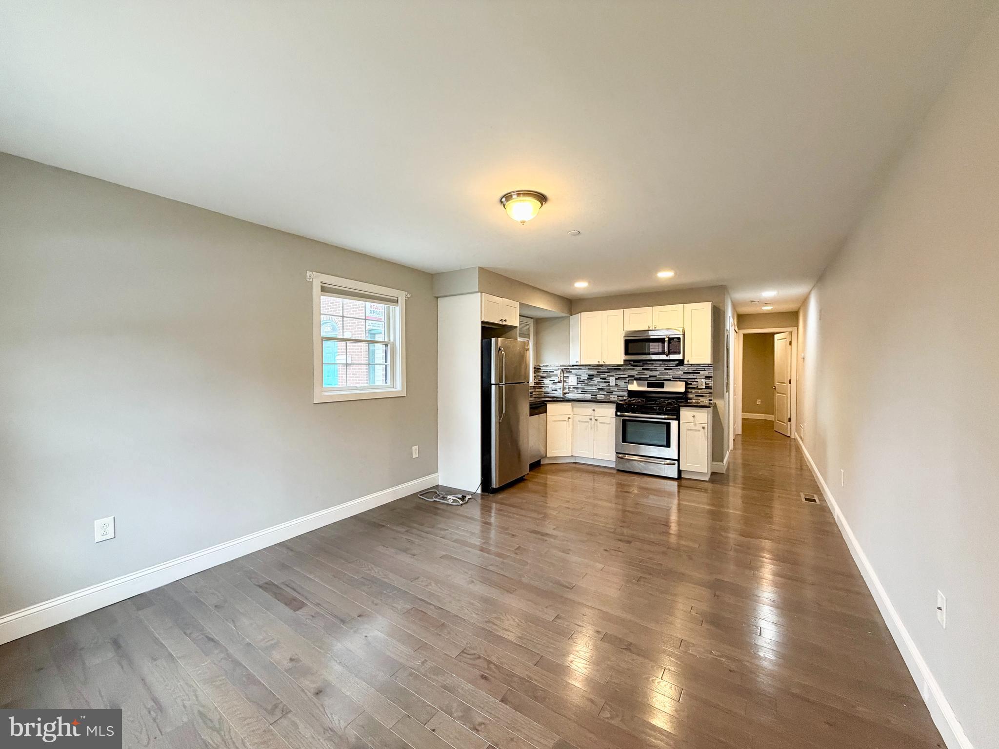 1014 East Moyamensing Avenue, Unit 1 Philadelphia, PA 19147 - Photo 11 of 11 a view of kitchen with wooden floor