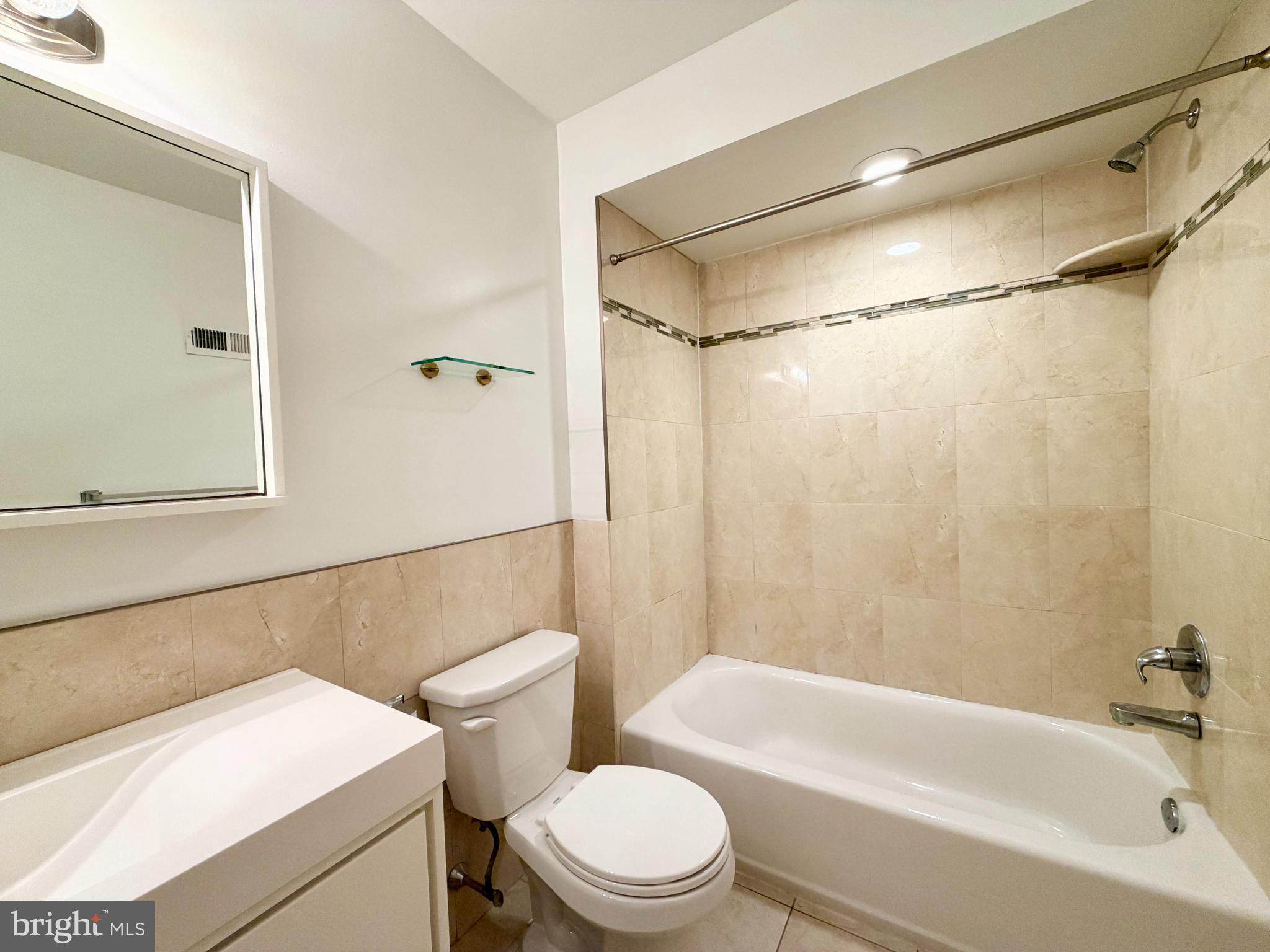 1014 East Moyamensing Avenue, Unit 1 Philadelphia, PA 19147 - Photo 5 of 11 a bathroom with a toilet a sink and a bathtub