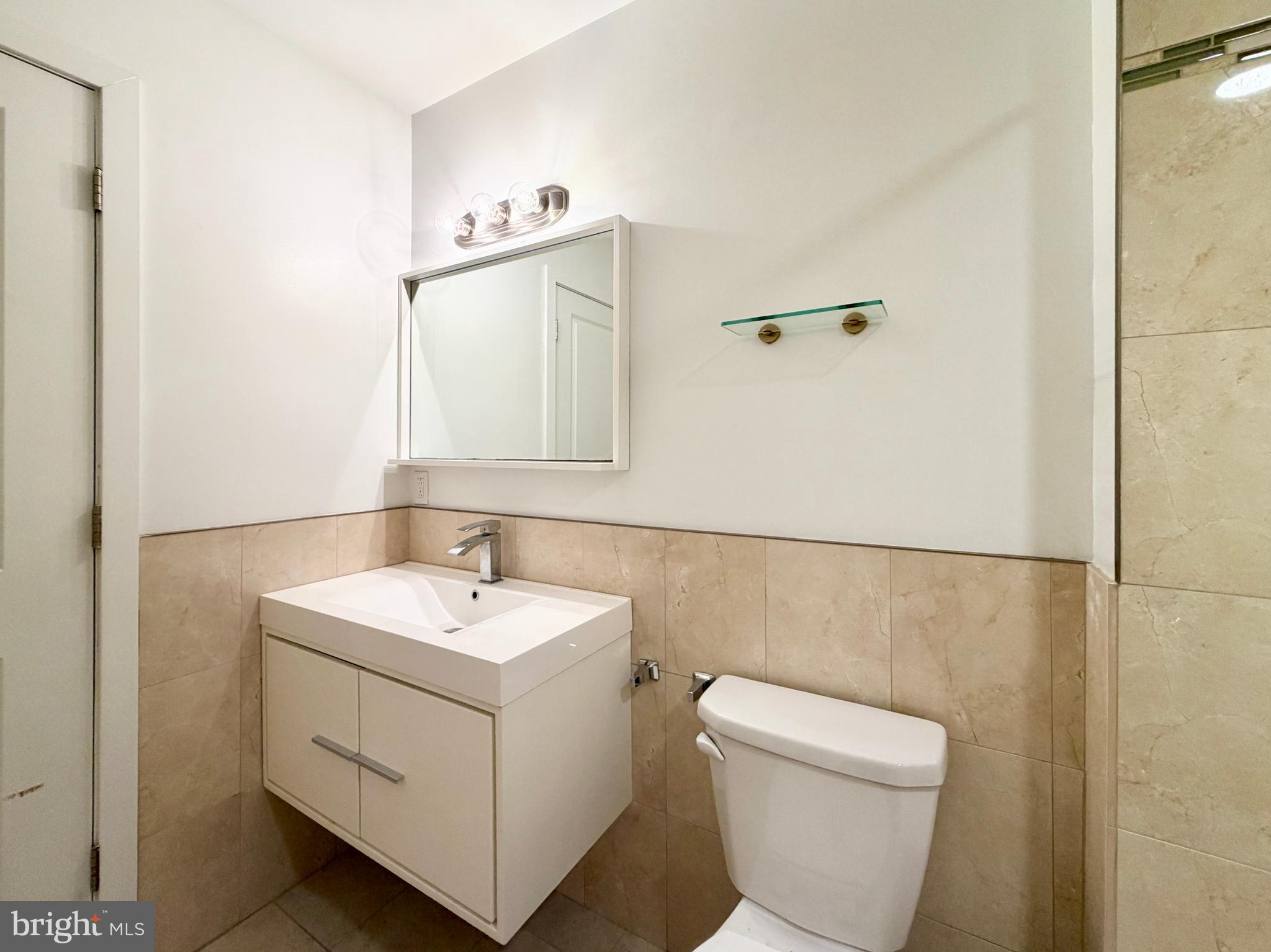 1014 East Moyamensing Avenue, Unit 1 Philadelphia, PA 19147 - Photo 6 of 11 a bathroom with a sink and a toilet