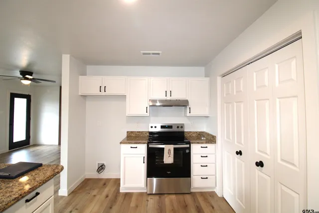 a kitchen with stainless steel appliances a stove and a refrigerator