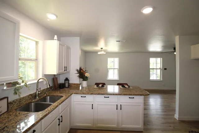 a kitchen with sink and window